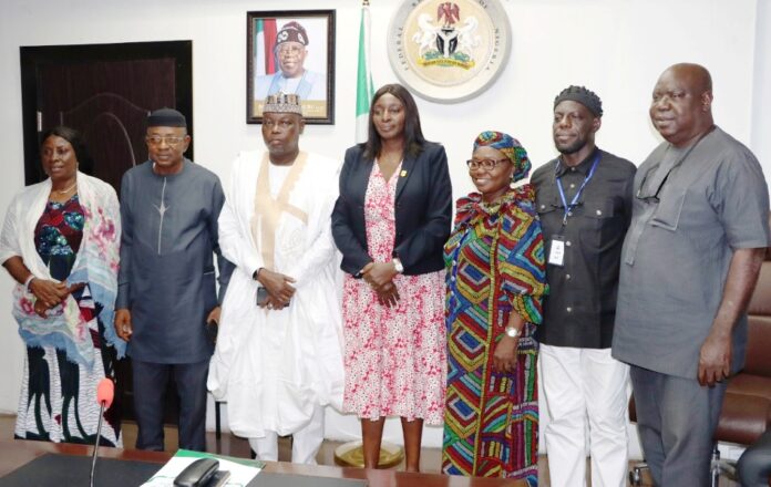 Permanent Secretary, Federal Ministry of Labour and Employment, Kachollom Daju, mni (meedle); Director, Occupational Safety and Health, Loretta Adogu (3rd right) with the newly Inaugurated committee members, Abuja