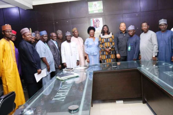 PSH flanked by the Directors and newly appointed MDs