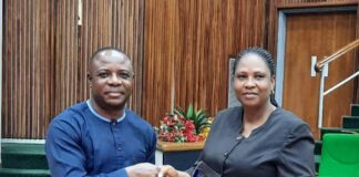 The-PS-Presenting-a-Plaque-and-gift-Items-to-the-representative-of-the-retired-Director-HRM-Mrs.-Funmi-Otu-Bassey.