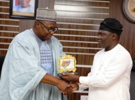 Left: Director, Human Resource Mgt. Dept.; Alhj. Mohammed K. Suleiman, mni ( rep. Perm.Sec.) presenting a souvenir to His Excellency, the Executive Governor of Taraba State, Dr. Agbu Kefas; during a courtesy visit to the Ministry of Mines & Steel Devlpt. Hdqtrs Abuja.