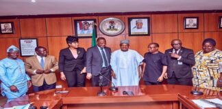 PIX OF (Centre)His Excellency Senator Abubakar Bagudu flanged by Mr Jacob Oduor Chief Country Economist AFDB and other director's from the Ministry during a courtesy visit in Abuja.