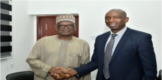 L-R: Director-General, Bureau of Public Procurement, BPP, Mamman Ahmadu, FNIQS in a warm handshake with Regional Procurement Coordinator African Development Bank, AfDB, Mr. Pairick Owuori during the meeting
