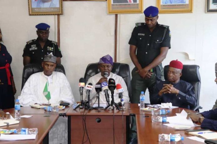 The Honourable Minister of Water Resources and Sanitation, Engr. Joseph Terlumun Utsev,(middle), the Honourable Minister of State, Bello Muhammad Goronyo (L) and the DG of NIHSA, Engr Clement Nze (R)