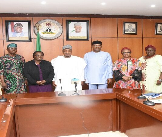 picture of the Honourable Minister ,Budget and Economic Planning ,Country Director IFAD, , the permanent secretary and directors in the ministry during a courtesy visit by IFAD team to the Honourable Minister at the Minister;s conference room.