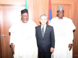 Honourable Minister of Defence, Muhammed Badaru Abubakar CON, mni (L); Honourable Minister of State for Defence Dr. Mohammed Bello Matawalle (R) and Japan Ambassador to Nigeria, Matsunaga Kazuyoshi (M) in a group photograph during the courtesy visit to Ship House, Abuja