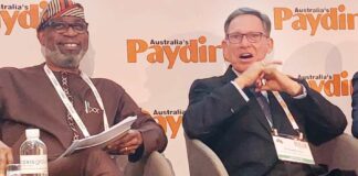 Minister of Solid Minerals, Mr. Oladele Alake discussing investment in mining in Nigeria with Managing Director, Basin Nigeria Limited, Dr.Steven Davies during the fourth session of the Africs Down Under mining conference in Perth, Austrralia on Wednesday.