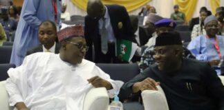 (Coordinating Minister of Health & Social Welfare) Prof. Muhammad Ali Pate and the (Minister of State for Health & Social Welfare) Dr. Tunji Alausa in a conversation at the Ministerial Briefing