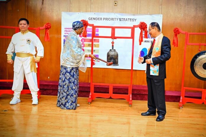 Peace Bell Ringer1 First Lady of the Federal Republic of Nigeria Senator Oluremi Tinubu CON rings the bell of peace, the 517th person to do so in the world and is observed by Dr Hong Tao-Tze, President of World Federation of World Peace and Love at the Commemoration of the International Day of Peace in New York