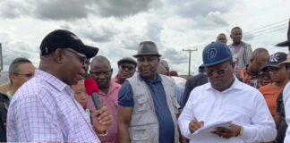 R-L : Minister of Works H.E. Sen (Engr ) David Nweze Umahi noting comment from the Deputy Governor of Delta State during his remarks Inset : R- Minister of Works H.E. Sen (Engr ) David Nweze Umahi addressing Commissioner for Roads and Bridges of Edo state,Osazemen Ethan Uzamere and representative of Levant Construction Company in Benin City during the inspection of Federal Roads in Benin and Delta States.