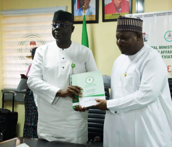 handing and taking over of office The new Permanent Secretary, Federal Ministry of Humanitarian Affairs and Poverty Alleviation, Abel Olumuyiwa Enitan (left) and the out-going Permanent Secretary Dr Nasir Sani-Gwarzo, mni, NPOM, during the handing and taking over of office held on Friday 1st August 2023 at the Ministry's conference room, Federal Secretariat. Abuja.