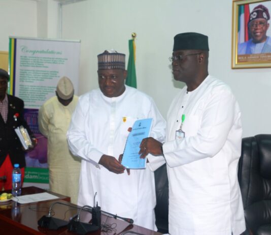 New Permanent Secretary, Ministry of Police Affairs, Dr. Nasir Sanni-Gwazor and outgoing (Perm Sec) Mr. Abel Olumuyiwa Enitan exchanging handover note at the Ministry’s Headquarters in Abuja.