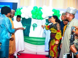 The 8th Edition of the Nigeria Mining Week- Left: Senator George Akume (representing Mr. President) unveiling the Nigeria Geological Survey Agency '"Metalogenic Map'' during the opening ceremony. Right: Minister for Solid Minerals Devpt. Dr. Oladele Alake assisting Senator Akume.