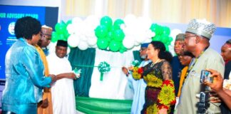 The 8th Edition of the Nigeria Mining Week- Left: Senator George Akume (representing Mr. President) unveiling the Nigeria Geological Survey Agency '"Metalogenic Map'' during the opening ceremony. Right: Minister for Solid Minerals Devpt. Dr. Oladele Alake assisting Senator Akume.