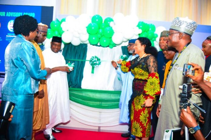8th Edition of the Nigeria Mining Week The 8th Edition of the Nigeria Mining Week- Left: Senator George Akume (representing Mr. President) unveiling the Nigeria Geological Survey Agency '"Metalogenic Map'' during the opening ceremony. Right: Minister for Solid Minerals Devpt. Dr. Oladele Alake assisting Senator Akume.