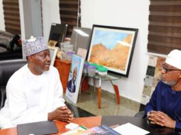 Hon. Minister of Solid Minerals Development, Dr. Oladele Alake, exchanging views with Mr. Samaila Zubairu, President/Chief Executive Officer, Africa Finance Cooperation.