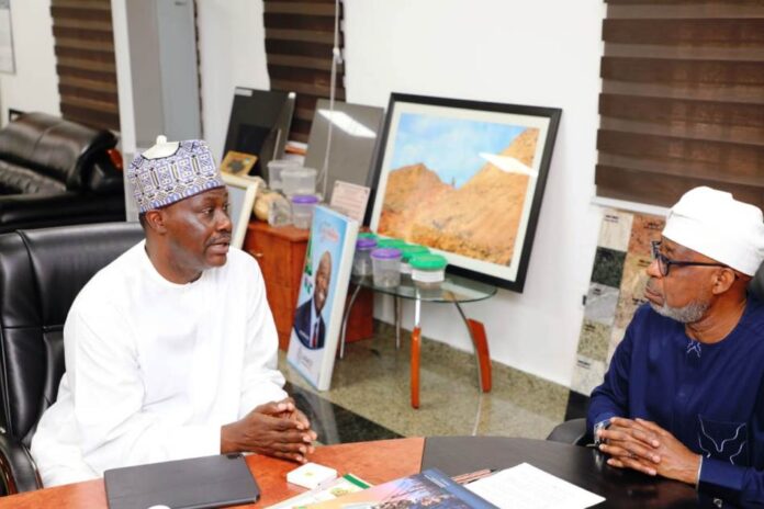Africa Finance Corporation1 Hon. Minister of Solid Minerals Development, Dr. Oladele Alake, exchanging views with Mr. Samaila Zubairu, President/Chief Executive Officer, Africa Finance Cooperation.
