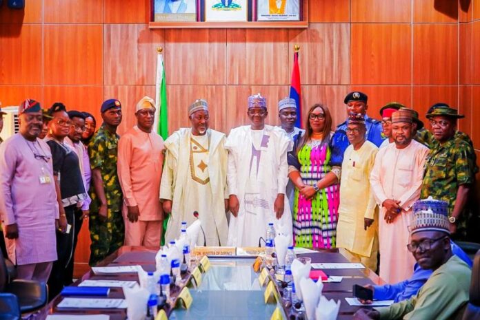 Honourable Ministers of Defence in a group photograph with the newly inaugurated members of the National Planning Committee of 2024 Armed Forces Remembrance Day Celebration
