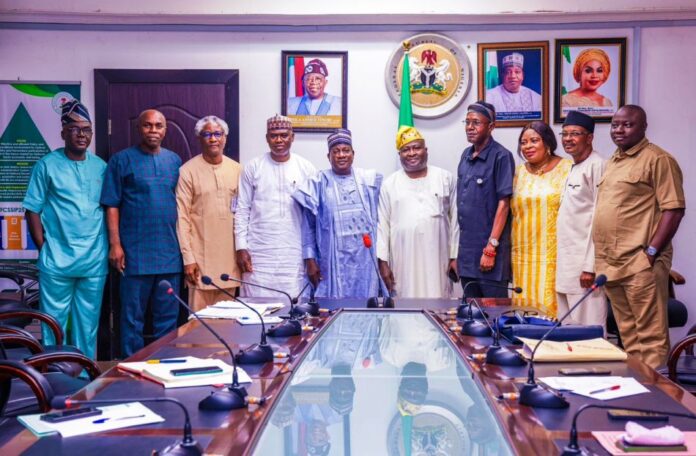 Hon. Minister of Labour and Employment, Simon Bako Lalong, CON (5th left); former President, Pharmaceutical Society of Nigeria (PSN), Olumide Akintayo (5th right); Director Trade Union Services and Industrial Relations, Emmanuel Igbinosun (3rd right) and other members of the JOHESU, during their courtesy visit to the Minister, Abuja