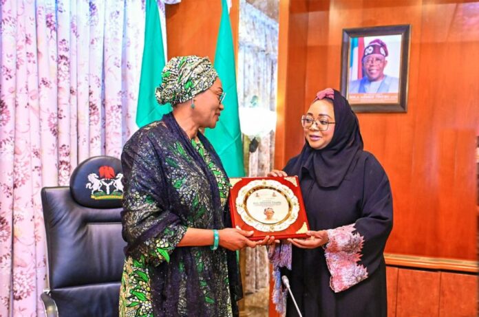 The First Lady of the Federal Republic of Nigeria, Senator Oluremi Tinubu CON (left) receiving a plaque from the Minister of State for Police Affairs Hon Imaan Suleiman-Ibrahim while on a courtesy visit to her office at the State House, Abuja on Monday 9th October 2023