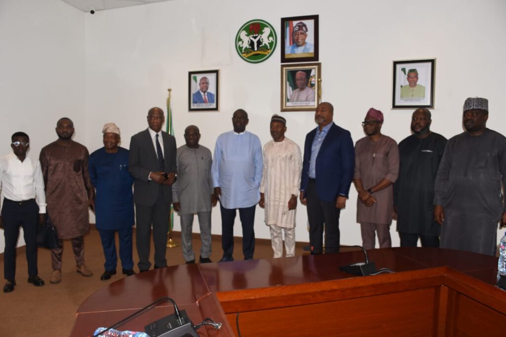 GROUP PHOTOGRAPH OF THE MINISTER OF STATE PETROLEUM RESOURCES (OIL), SEN. HEINEKEN LOKPOBIRI Ph.D WITH A DELEGATION FROM THE CRUDE OIL REFINERIES OWNERS' ASSOCIATION OF NIGERIA (CORAN) ON A COURTESY VISIT TO THE MINISTER IN ABUJA