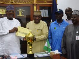 l-R: Minister of Police Affairs, Senator Ibrahim Gaidam; Permanent Secretary, Dr. Nasir Sani-Gwarzo; Sports Manager, Philip Mayaki; Director (HRM), Muhammad Mogaji Taura; Welfare Bere Princess and General Secretary, Uchechi Nwaiwu during the presentation of the second-best trophy and certificate for Best Behaved MDAs for the September 2023 Edition of the Keep-Fit Aerobics Exercise to the Honourable Minister at the Ministry Headquarters in Abuja.