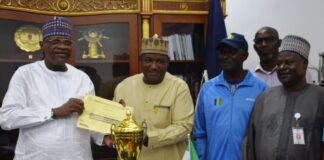 l-R: Minister of Police Affairs, Senator Ibrahim Gaidam; Permanent Secretary, Dr. Nasir Sani-Gwarzo; Sports Manager, Philip Mayaki; Director (HRM), Muhammad Mogaji Taura; Welfare Bere Princess and General Secretary, Uchechi Nwaiwu during the presentation of the second-best trophy and certificate for Best Behaved MDAs for the September 2023 Edition of the Keep-Fit Aerobics Exercise to the Honourable Minister at the Ministry Headquarters in Abuja.