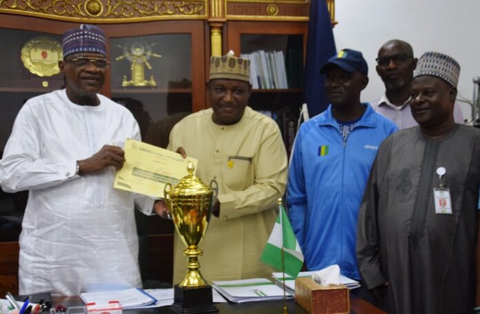 l-R: Minister of Police Affairs, Senator Ibrahim Gaidam; Permanent Secretary, Dr. Nasir Sani-Gwarzo; Sports Manager, Philip Mayaki; Director (HRM), Muhammad Mogaji Taura; Welfare Bere Princess and General Secretary, Uchechi Nwaiwu during the presentation of the second-best trophy and certificate for Best Behaved MDAs for the September 2023 Edition of the Keep-Fit Aerobics Exercise to the Honourable Minister at the Ministry Headquarters in Abuja.
