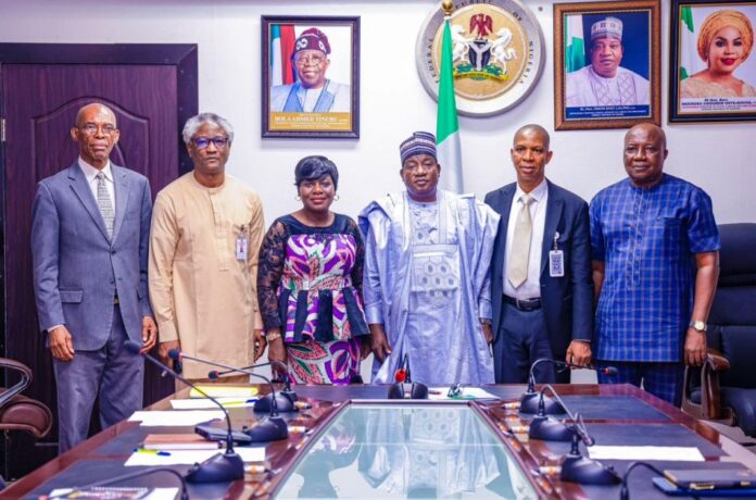 Hon. Minister of Labour and Employment, Simon Bako Lalong, CON (3rd right) with the newly inaugurated five-man fact-finding committee to investigate various complaints and petitions against the management of the Nigeria Social Insurance Trust Fund (NSITF), Abuja