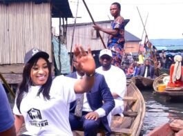 Honourable Minister of Humanitarian Affairs and Poverty Alleviation, Dr. Betta Edu (in front waiving) taking a canoe trip to one of the Communities in Makoko, a lagos suburb to flag off the National Social Register verification, over the weekend.