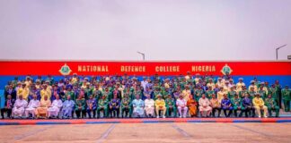 Honourable Minister of State for Defence, Dr Bello Muhammed Matawalle MON, Permanent Secretary, Ministry of Defence, Dr Ibrahim Abubakar Kana mni, Chief of Defence Staff, Gen. CG Musa, Cmdt of NDC, Rear Admiral OM Olotu in group photograph with Participants of NDC Course 32 at the inauguration ceremony.