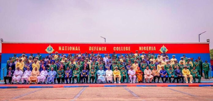 Honourable Minister of State for Defence, Dr Bello Muhammed Matawalle MON, Permanent Secretary, Ministry of Defence, Dr Ibrahim Abubakar Kana mni, Chief of Defence Staff, Gen. CG Musa, Cmdt of NDC, Rear Admiral OM Olotu in group photograph with Participants of NDC Course 32 at the inauguration ceremony.