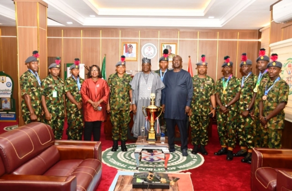 Minister of Defence for State, Dr Muhammad Bello Matawalle (M) with the Ministry's management staff, including the NDA Commandant, Maj Gen JO Ochai and the naval cadets in a group picture in Ship House, Abuja