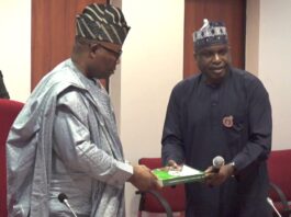 (R-L) Perm Sec Ecological Project Office, Malam Shehu Ibrahim, presenting a copy of the Compendium to the Senate President, Senator Godswill Obot Akpabio