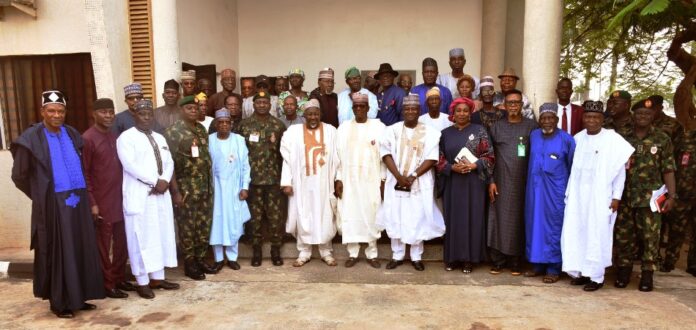Veterans in a group picture Minister of Defence, Muhammad Badaru Abubakar, Minister of Defence for State, Dr Muhammad Bello Matawalle, Ministry's Permanent Secretary, Dr Ibrahim Abubakar Kana, management staff of the Ministry and Veterans in a group picture in Ship House, Abuja