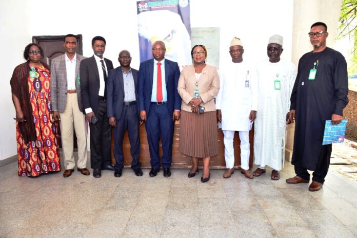 Representative of the Permanent Secretary, Ministry of Defence, Ms Ahubi Susan Ochida (M), the resource person, Mr Adebayo Obaniyi of ICPC (5th L), and management staff of the Ministry during the sensitization programme on anti corruption held in Ministry of Defence, Abuja.