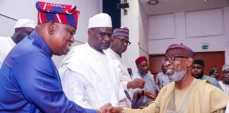 Honorable Minister of Solid Minerals Development, Dr. Dele Alake (Right) with the chairman, Senate committee on Appropriation, Senator, Solomon Olamilekan Adeola (Yayi) exchanging greetings during the Budget Defence session in NASS, Abuja.