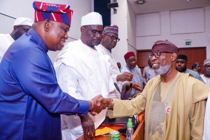 Budget Defence session in NASS Honorable Minister of Solid Minerals Development, Dr. Dele Alake (Right) with the chairman, Senate committee on Appropriation, Senator, Solomon Olamilekan Adeola (Yayi) exchanging greetings during the Budget Defence session in NASS, Abuja.