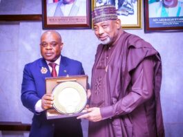 Secretary General, D8 Countries in Africa, Ambassador, Isiaka Imam, presenting a plaque to the Minister of Agriculture and Food Security, Sen. Abubakar Kyari, during courtesy visit in Abuja.