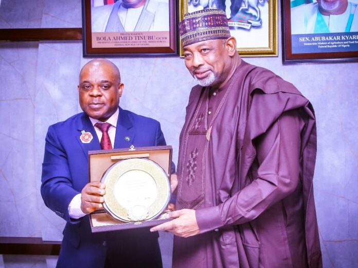 D-8 courtesy visit Secretary General, D8 Countries in Africa, Ambassador, Isiaka Imam, presenting a plaque to the Minister of Agriculture and Food Security, Sen. Abubakar Kyari, during courtesy visit in Abuja.