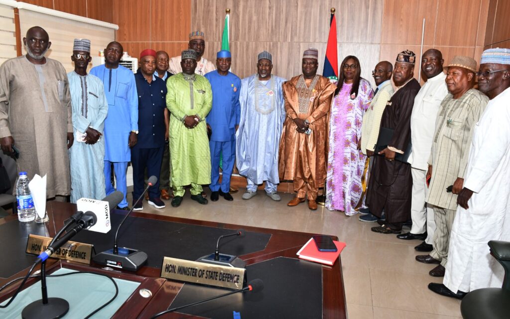 Minister of Defence, Muhammad Badaru Abubakar, CON (M), the Permanent Secretary, Ministry of Defence, Dr Ibrahim Abubakar Kana, mni (7th R) and the Veterans in a group picture in Ship House, Abuja