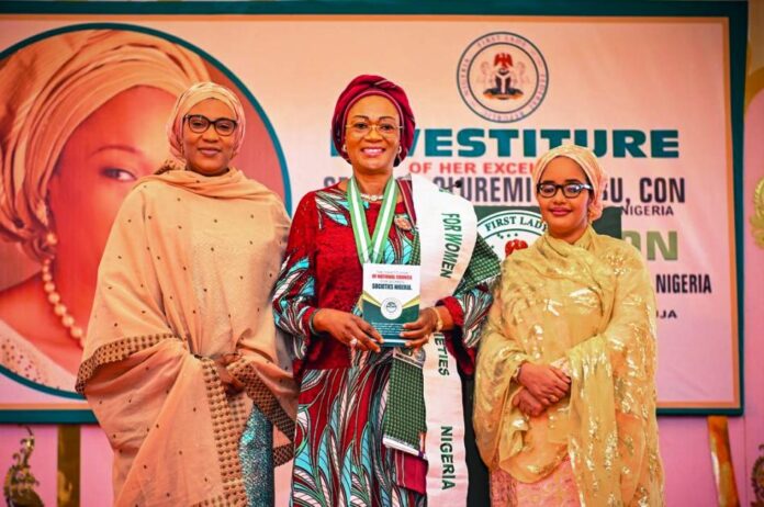 From left: Wife of the Vice President of the Federal Republic of Nigeria Hajia Nana Shetima, First Lady of the Federal Republic of Nigeria Senator Oluremi Tinubu, CON and Wife of the Speaker House of Representatives Hajia Fatima Tajudeen Abass at the investiture of the First Lady as the Grand Patron of The National Council for Women Societies, NCWS, Nigeria held at the State House Abuja