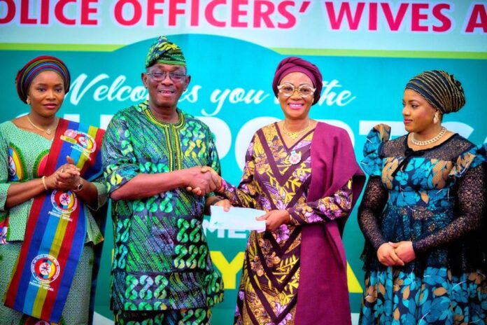 From left Wife of the Chief of Defence Staff and President DEPOWA, Mrs Oghogho Musa, a beneficiary of the RHIESS, First Lady of the Federal Republic of Nigeria, Senator Oluremi Tinubu, CON and the wife of the Deputy Senate President Mrs Benjamin Kalu as the First Lady presents One Hundred Thousand Naira to the Elderly Citizen at the Renewed Hope Initiative Elderly Support Scheme in Abuja where 250 people benefited from each state, the FCT and Armed Forces Veterans