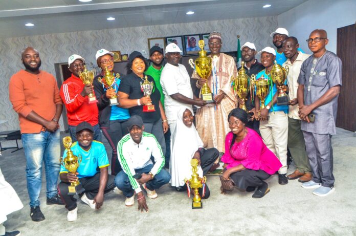 Ministry Of Works and Housing Sports Club Presents 2023 Sports Trophies to the Hon. Minister of Housing and Urban Development, Arc. Ahmed Musa Dangiwa in his office, Wednesday 20th December 2023