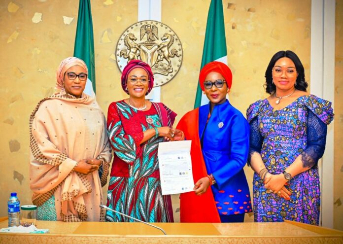 Wives of State Governors2 From Left: Wife of the Vice President Hajia Nana Shetima, First Lady of the Federal Republic of Nigeria, Senator Oluremi Tinubu, CON, Wife of the Kwara State Governor and Chairperson of Governors Spouses Forum, Amb Olufolake Abdulrazaq and Wife of Imo State Governor Mrs. Chioma Uzodinma while the First Lady was presenting a draft of Twenty-Five Million Naira to the Amb. Abdulrazaq towards the upcoming RHIESS Program holding simultaneously in the 36 States and FCT on the 21st of December 2023