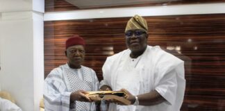 R-L: Incoming Chairman, Prof. Tunji Olaopa received hand-over documents from Dr. Jonah Madugu- former acting Chairman.