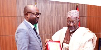 The Minister of Defence, Muhammad Badaru Abubakar, CON presenting a plague to Minister of Interior, Hon. Olubumi Tunji Ojo when the later paid a courtesy visit to Ship House, Abuja on Tuesday, 14th November, 2023.