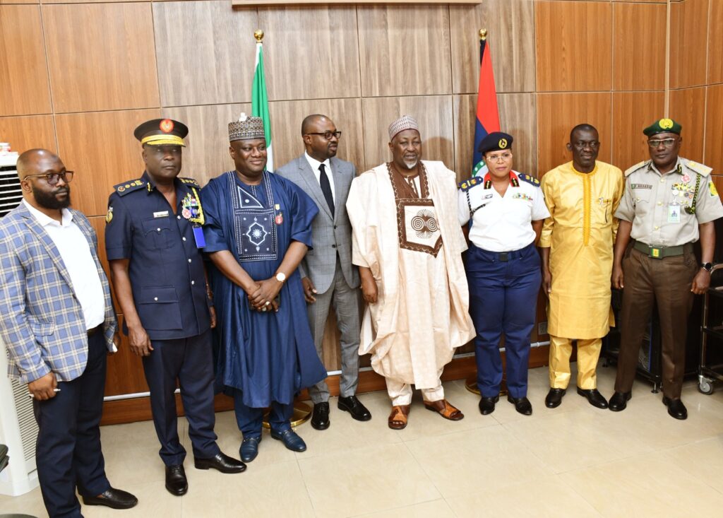 Minister of Defence, Muhammad Badaru Abubakar CON (M), Minister of Interior, Hon. Olubumi Tunji Ojo (4th L), Permanent Secretary, Ministry of Defence Dr. Ibrahim Abubakar Kana mni (3rd L) management staff of Ministry of Interior in a group picture in Ship House, Abuja.