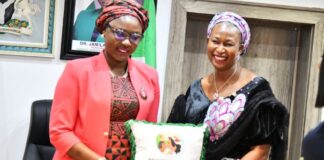 Hon. Minister of Youth Develooment, Dr. Jamila Bio-Ibrahim receiving a present from the National President of the Progressive Young Women forum , Hon. Patience Kwache during their courtesy call on the Minister.
