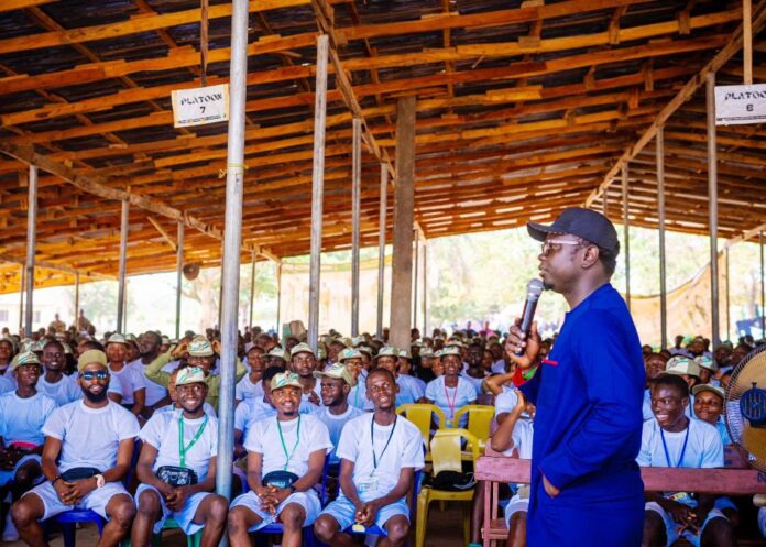 Corps members Mr Ayodele Olawande the Hon. Minister of State for Youth Development addressing the Corps members during his visit to their camp at Asaya in Kabba, Kogi state.