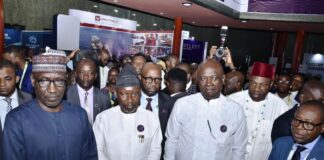 From right- Hon. Minister of State, Petroleum Resources (Oil) Sen.Heineken Lokpobiri Ph.D;Permanent Secretary in the Ministry, Amb. Nicholas Agbo Ella and Hon. Minister of State Petroleum Resources(Gas), Rt. Hon. Ekperikpe Ekpo, listening to presentations during a guided tour of Exhibition Stands at the 2024 Nigerian International Energy Summit holding at the International Conference(ICC), Abuja.